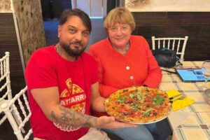 Angela Merkel con Pierpaolo Battarra