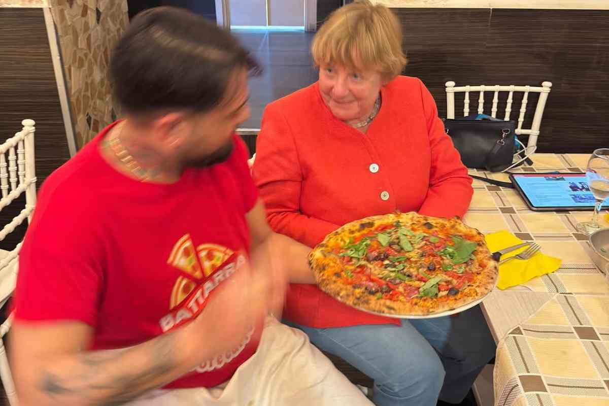 Angela Merkel con Pierpaolo Battarra